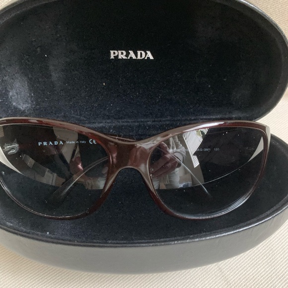 Prada brown sunglasses model spr07g with case.